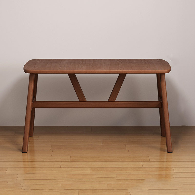 Wooden bench with rounded edges and cross-braced legs